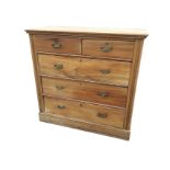 A late Victorian satin walnut chest of drawers, the rectangular top above two short and three long