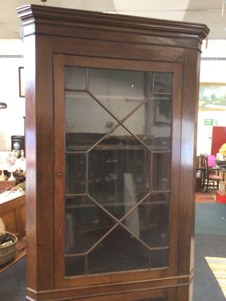 A large nineteenth century mahogany corner cupboard with moulded cornice above two astragal glazed - Image 3 of 3
