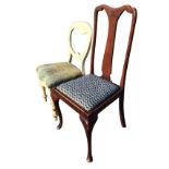 A Queen Anne style dining chair with shape splat above a drop-in upholstered seat raised on cabriole