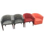 A set of three tub armchairs with horseshoe shaped backs above cushion seats, raised on square