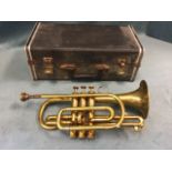 A cased Carzan cornet, the brass instrument numbered 65028, the three valves with mother-of-pearl