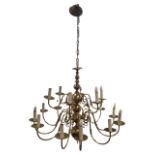 A large brass chandelier hung by chain from circular moukded ceiling rose, the bulbous column with