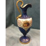 A Royal Worcester ewer with acanthus scrolled burnished gilt handle, handpainted with circular fruit