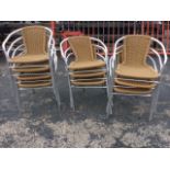 A set of ten aluminium framed garden chairs with faux cane backs & seats, the tubular frames with