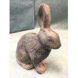 A seated lead rabbit with pointy ears. (9in)