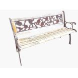 A cast iron garden bench having back with pierced floral leaf panel above a slatted seat, with