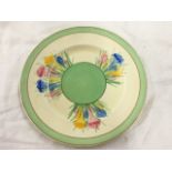 A Clarice Cliff Staffordshire plated decorated in the crocus pattern with handpainted flowers on