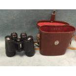 A leather cased set of Carl Zeiss jenoptem 10 x 50 binoculars with multi-coated lenses - numbered