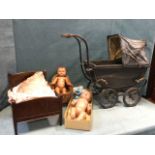 An Edwardian childs pram on sprung frame with spoked wheels and wood handle; two 60s jointed dolls