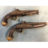 A pair of nineteenth century style percussion cap pistols, with engraving to steel barrels and