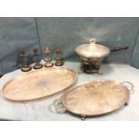 A set of four stylised silver plated candlesticks on ebonised oak plinths dated 1951; two oval