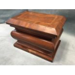 A Victorian mahogany tea caddy of bulbous sarcophagus form having chequered stringing to hinged lid,