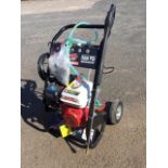 A German Würzburg 3000 PSI pressure washer on wheeled frame with instruction booklet - unused.