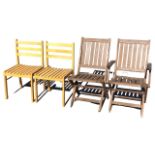 A pair of modern barback chairs with slatted seats; and a pair of folding garden chairs with slatted