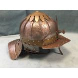 A fluted European lobster-tail Burgonet type helmet, having riveted brass mounts and adjustable