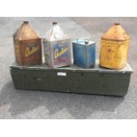 A rectangular ex:army aluminium trunk with carrying handles to ends; three oil cans with pyramid