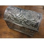 An eastern silver casket, the velvet lined weighted trunk with domed hinged lid embossed with