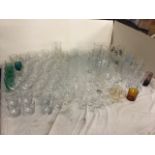 A large quantity of drinking glass - wine glasses, some cut Edinburgh crystal, branded glasses,