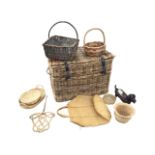 A large wicker basket with buckles and leather straps; and a miscellaneous other cane selection of