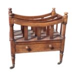 A nineteenth century mahogany canterbury with three divisions framed by dished rails on slats, the