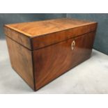 A nineteenth century mahogany tea caddy, the hinged covers decorated with satinwood banding,