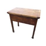 A rectangular oak mangle table, the cleated turn-over-top with brass hinges revealing a cast iron