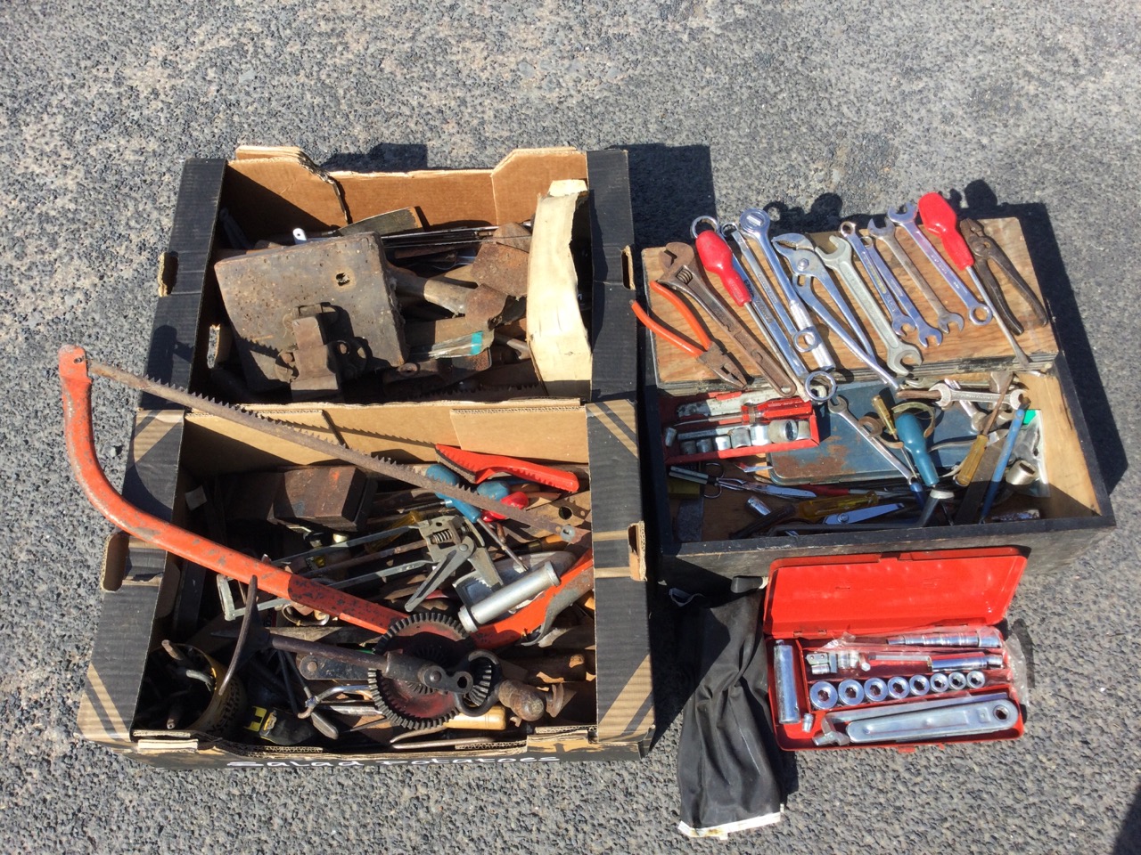 A small chest of mechanics tools including spanners, pliers, a socket set, etc.; and two boxes of