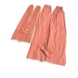 A pair of lined pink linen curtains with tie-backs - 86in; and another smaller lined pair - 65in. (