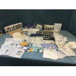 A collection of stamps, mainly first day covers, new unused stamps, commemorative sets, loose