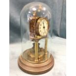 A Victorian brass Gustav Becker anniversary clock under glass dome, the movement on twin pillars