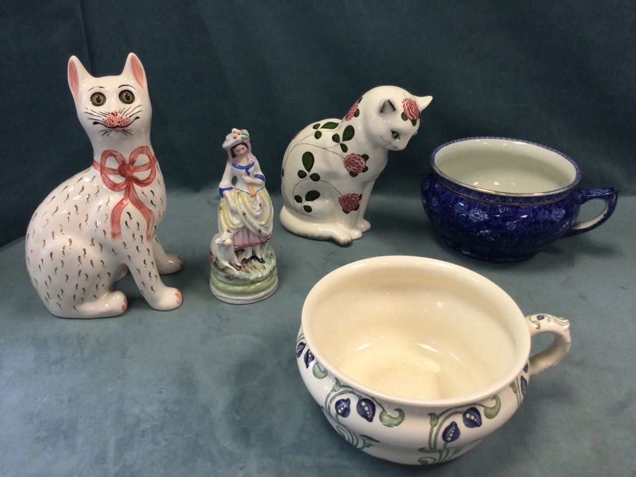A Plichta ceramic cat set with glass eyes decorated with clover; another cat by the Griselda Hill