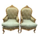 A pair of Louis XV style fauteuils, the upholstered backs in moulded giltwood frames with pierced