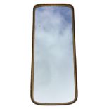 A long rectangular rounded brass framed mirror with twisted rim. (16in x 39.75in)
