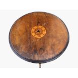 A circular nineteenth century walnut occasional table, the moulded top inlaid with scrolled