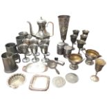 A quantity of silver plate including a hammered floral embossed tapering vase, a large coffee pot,