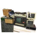 Miscellaneous 70s computer gear including an early Apple RGB monitor, a Polaroid CP50 monitor, a
