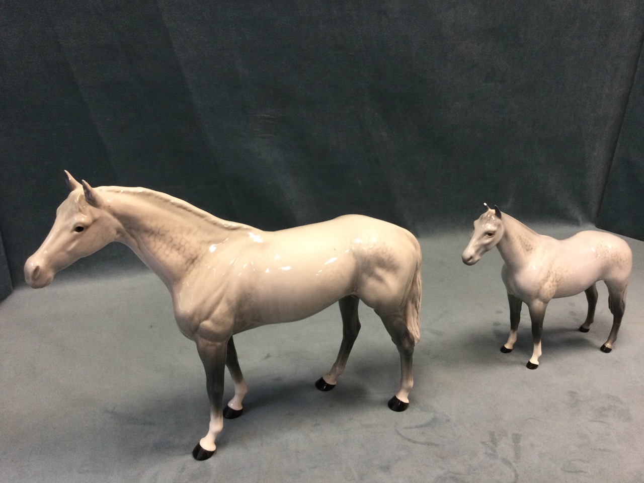 A graduated pair of Beswick dappled grey horses. (11in & 8in) (2) - Image 2 of 3