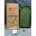A boxed Corinthian bagatelle board with brass pins and holes, complete with 11 ball bearings and
