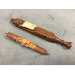 A nineteenth century carved knitting sheath with hearts & roundels to square shaft - initialed MS,