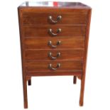 An Edwardian mahogany music cabinet, the rectangular moulded top, above five drop-front drawers