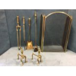A set of three brass fire irons with square shafts having knob finials - shovel, poker & tongs; a