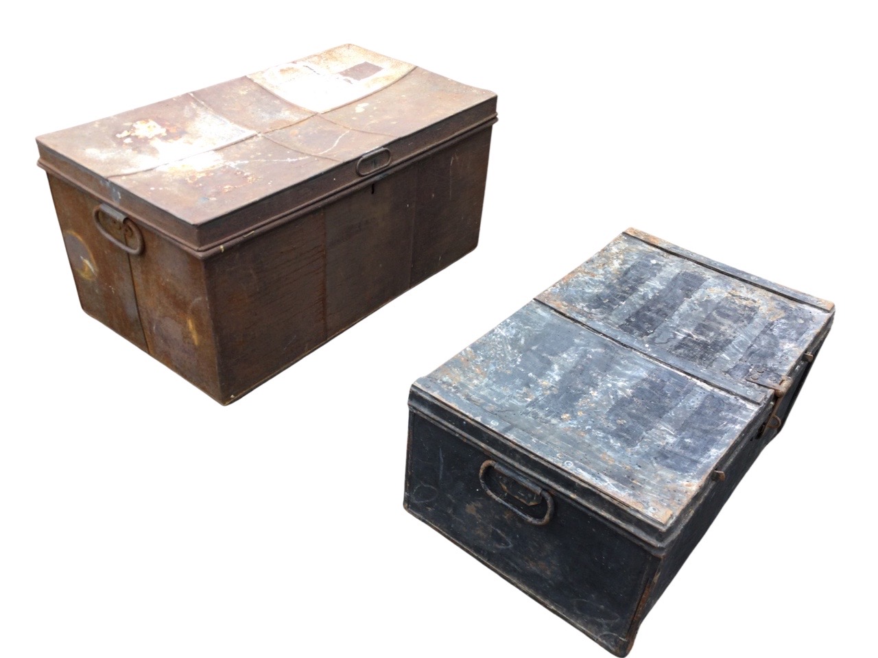A rectangular tin trunk with zinc lined interior; and another metal trunk dated 1942, with