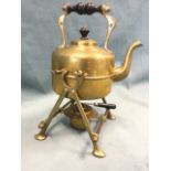 A Victorian tea kettle, the stand with cross legs on pad feet holding burner, supporting a bun