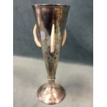 A tapering 1930s German silver vase by E Eckert, with moulded rim, the sides mounted with three