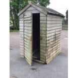 A lap-boarded garden shed with pitched felt roof, having hinged door - A/F. (45.5in x 58in x 80in)