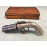 A nineteenth century mahogany cased steel & silver pepperpot percussion cap pistol, the revolving