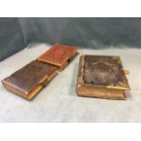 A Victorian embossed leather bound photo album with brass mounts; another similar with floral