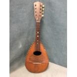 An Italian mandolin by Marca di Casbrica with chequered purfling to cedar soundboard having