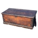 A nineteenth century dovetailed mahogany marine chest with rope handles and iron mounts, the