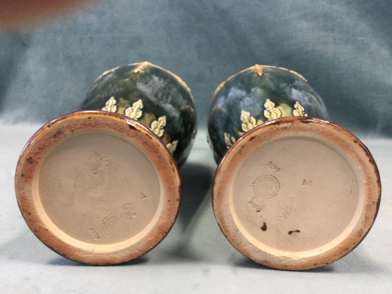A pair of Royal Doulton tapering stoneware vases with waisted necks, having applied swagged - Image 3 of 3